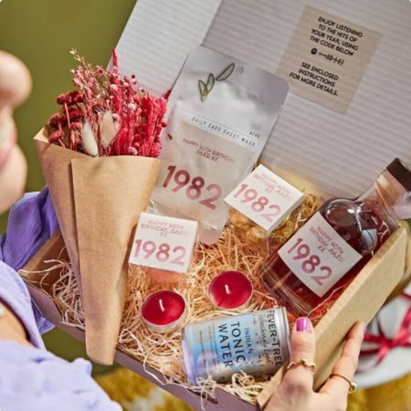 gin-themed gifts A gift basket with a personalized gin bottle