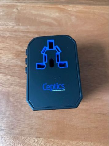 travel gifts for dad A black travel adapter
