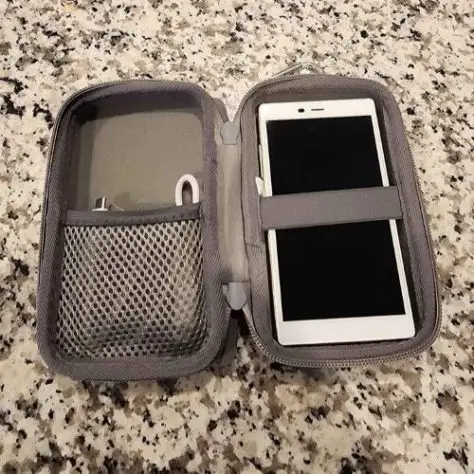 travel gifts for dad A grey holder for a white mobile hotspot