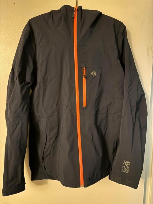 travel gifts for dad A black rain jacket from Mountain Hardwear