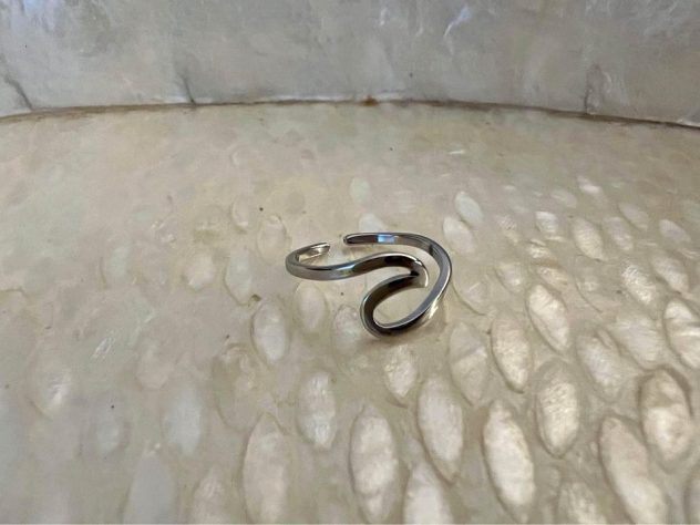 ocean-themed gifts A silver ring with a shape of an ocean wave