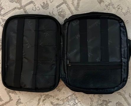 travel gifts for dad A black travel cord organizer