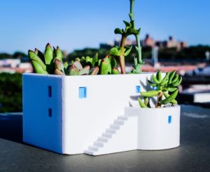 greek gift ideas A planter shaped like a white house on a Greek island
