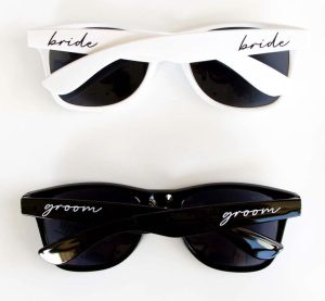 wedding gifts for travelers Matching sunglasses with "bride" and "groom"