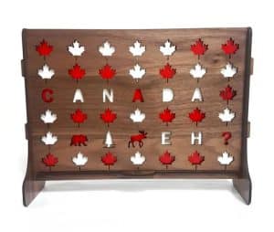 A wooden game of connext four with maple leafs