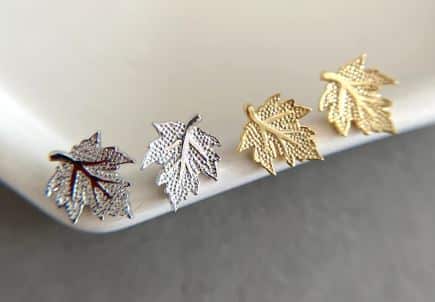 Two pairs or earring buds in the shape of maple leaves