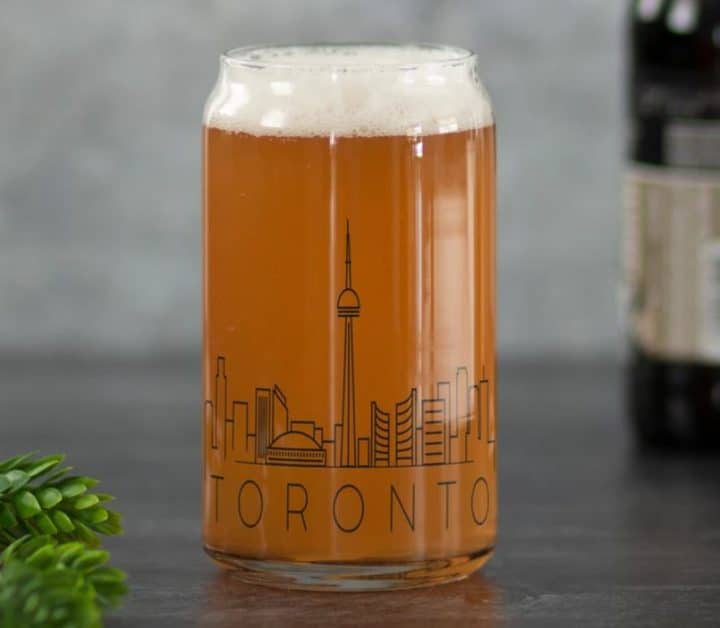 A beerglass with the skyline of Toronto etched