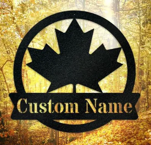 A metal sign of a maple leaf and a cutom name