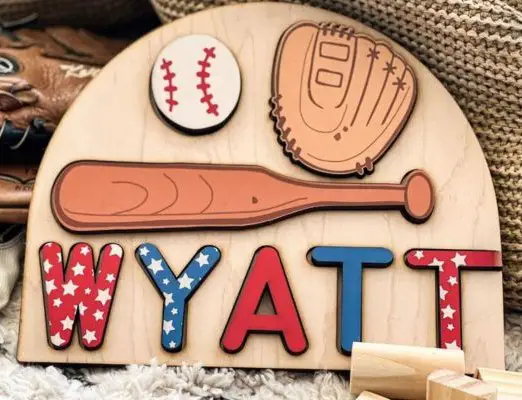 A wooden puzzle with a name and baseball elements for kids