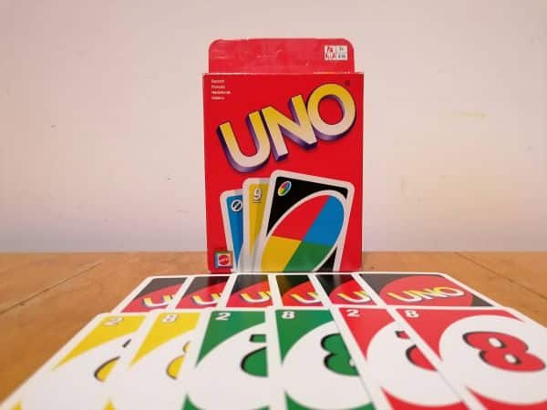 games for travelers Package and cards from the travel game "Uno"
