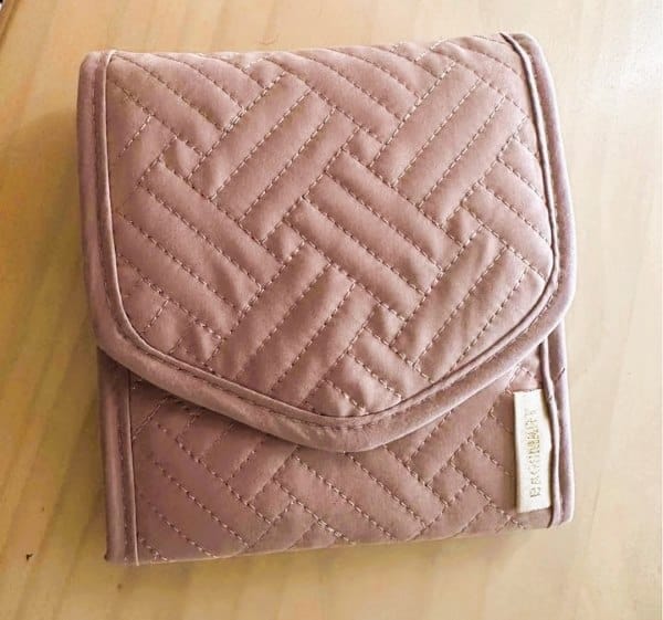 gifts for a daughter traveling abroad A pink wallet shaped jewelry organizer for travelers