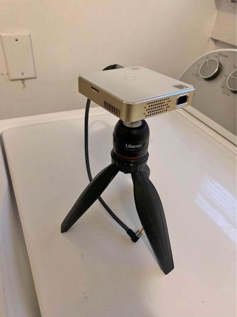 travel gifts for teenagers A mini projector on a tripod