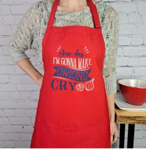 gifts for soup lovers A woman wearing a red apron with "one day, I will make onions cry"