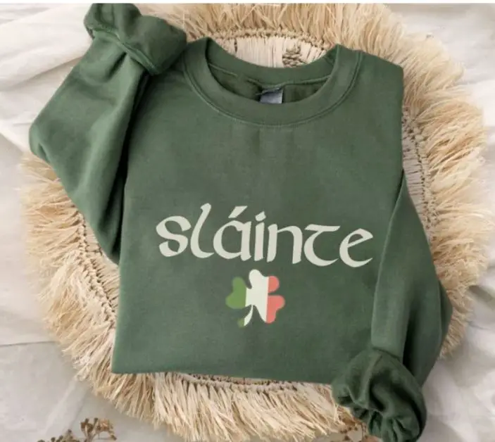 St Patrick's day gifts A green sweater with "Slaince" and a clover in the color of the flag of Ireland