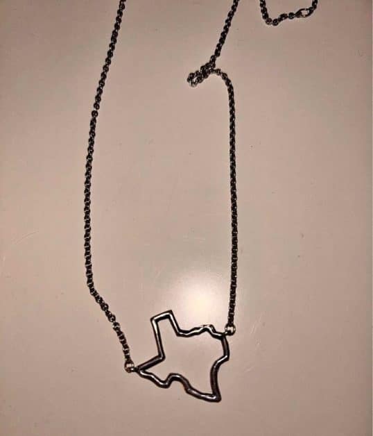 Texas gift ideas A silver necklace with a pendant in the shape of Texas