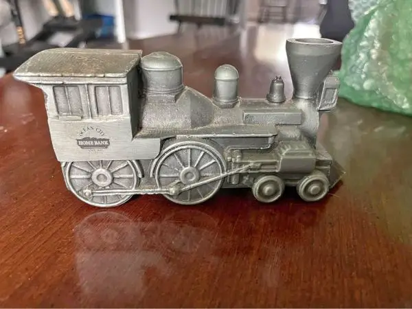 gifts for train lovers A piggy bank made from metal in the shape of a train locomotive