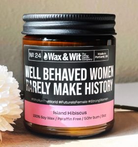 gifts for history buffs Candle with a funny label that says "well behaved women rarely make history"