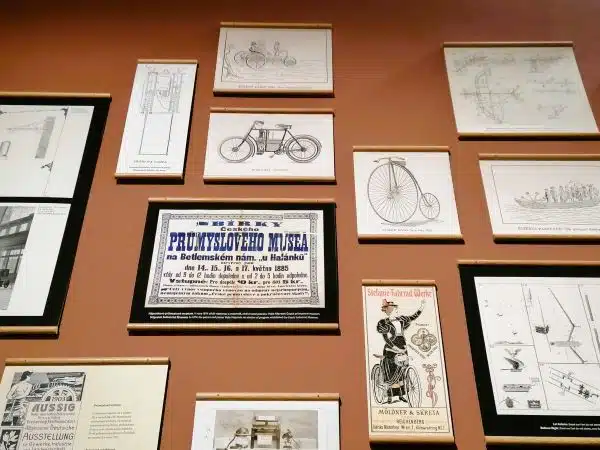 gifts for history buffs A wall with prints of old bicycles and other forms of transportation