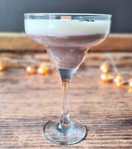 A candle made in a martini glass