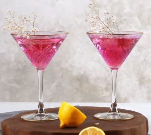 Two martini glasses with pink insides