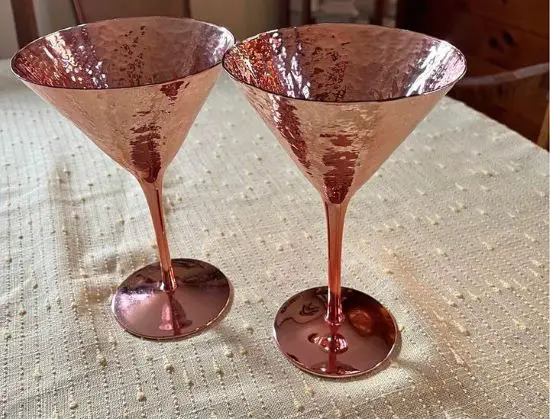 Two copper martini glasses
