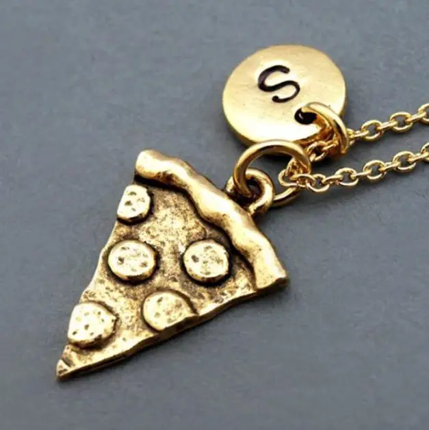 gifts for pizza lovers A golden necklace with a pendant of a slice of pizza