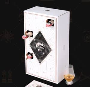 A white box with 21 openings for whiskey bottles