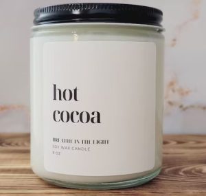 A wax candle with the label of "hot cocoa"