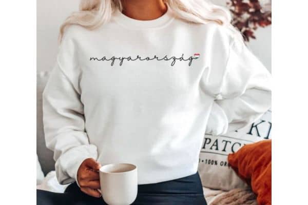 Woman wearing a white sweatshirt with "Hungary"