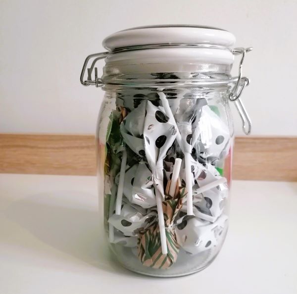 A jar filled with lollipops