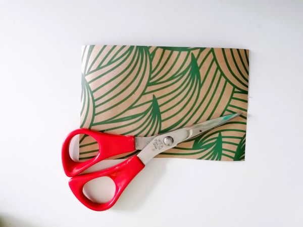 A piece of wrapping paper and a pair of scissors