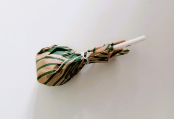 A lollipop wrapped in paper