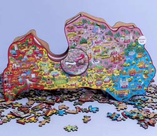 Latvian gifts A colorful jigsaw puzzle in the shape of the map of Latvia