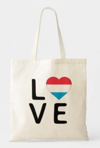 A tote bag with the word "love" and the "o" as a heart with the colors of the flag of Luxembourg