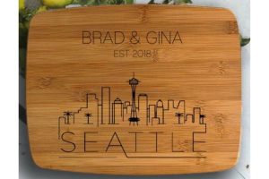 Seattle gifts A wooden chopping board with a personalization and the skyline of Seattle