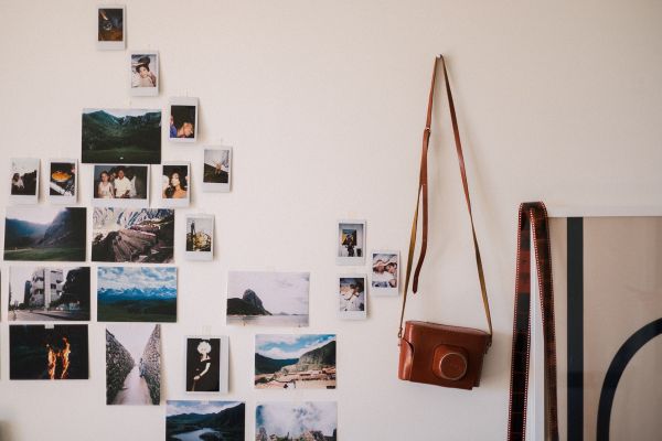 A wall with a photo display