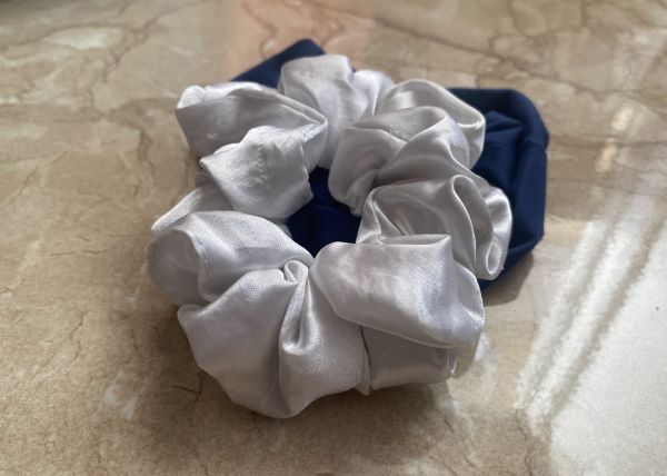 A blue and a white scrunchie