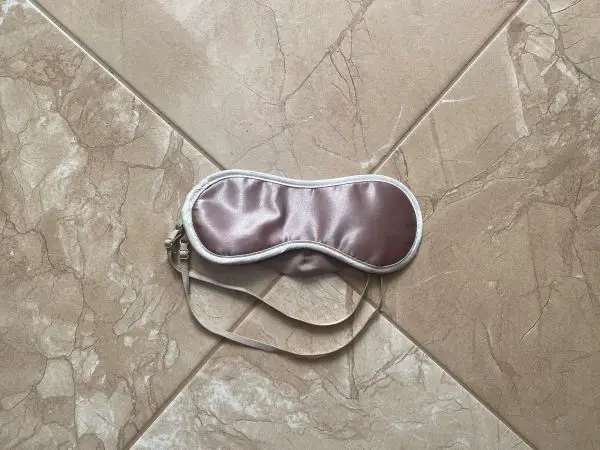 A pink silk sleeping mask