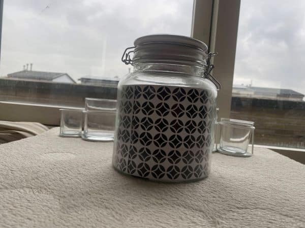 A mason jar with a black and white print