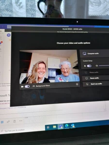 A young woman and a grandmother on an online meeting