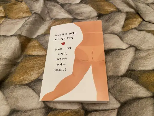 A card with "I love you with all my bum, I would say heart, but my bum is bigger"